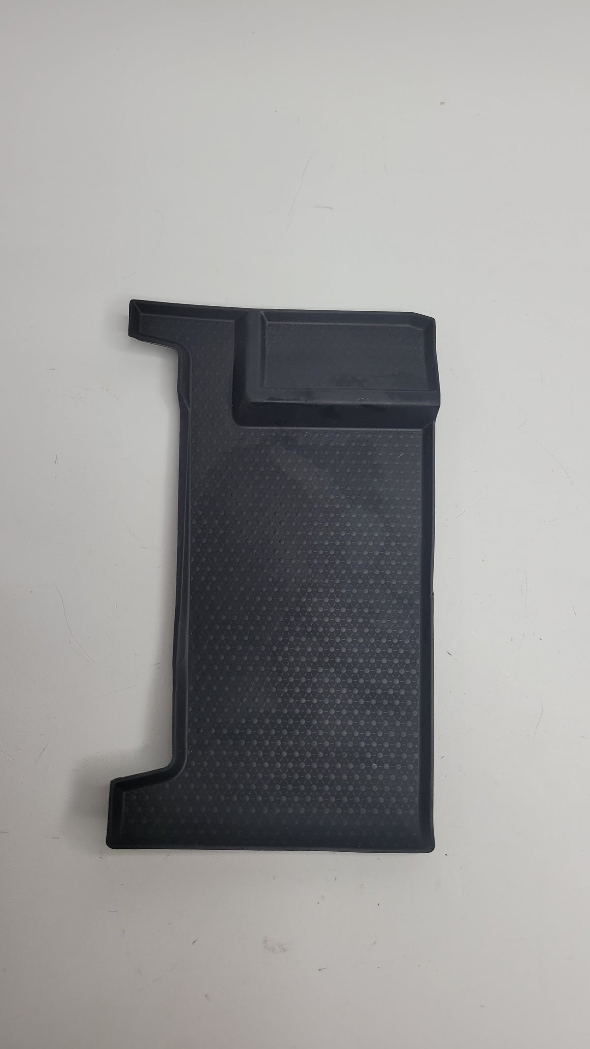 BMW G80 M3 center armrest storage bin insert mat by MPerformance.parts, showing the textured black interior fit for the armrest storage area.