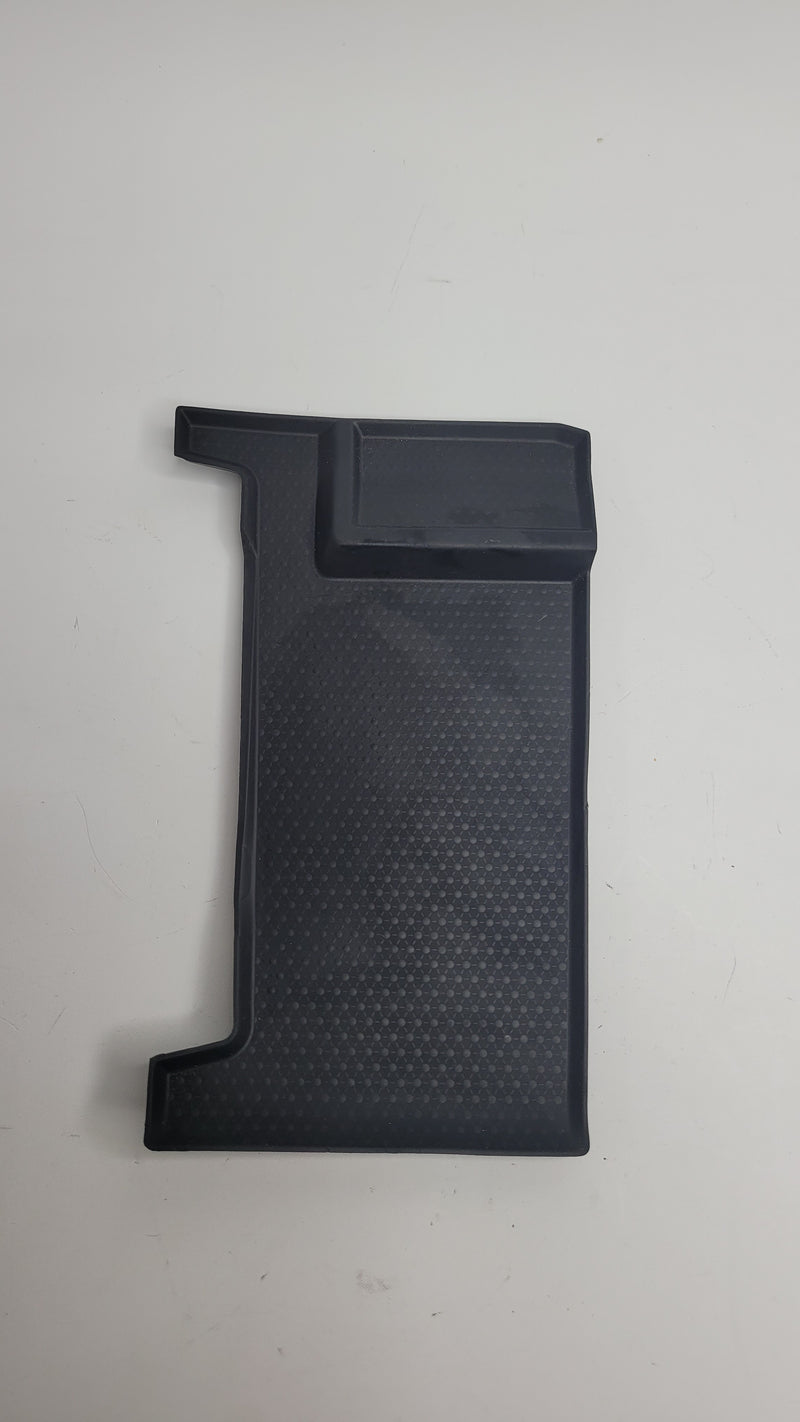 BMW G80 M3 center armrest storage bin insert mat by MPerformance.parts, showing the textured black interior fit for the armrest storage area.