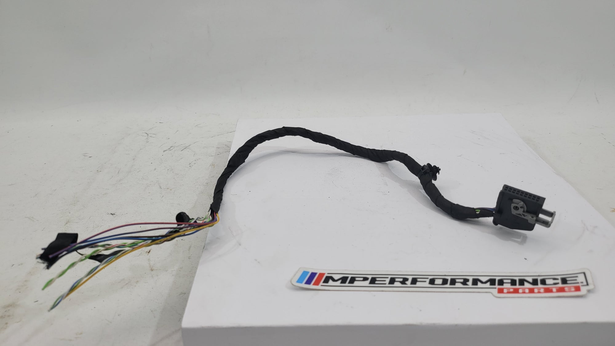 BMW Tyre Pressure Module Plug 8364654 by MPerformance.parts, close-up of the automotive sensor component for tire pressure monitoring.