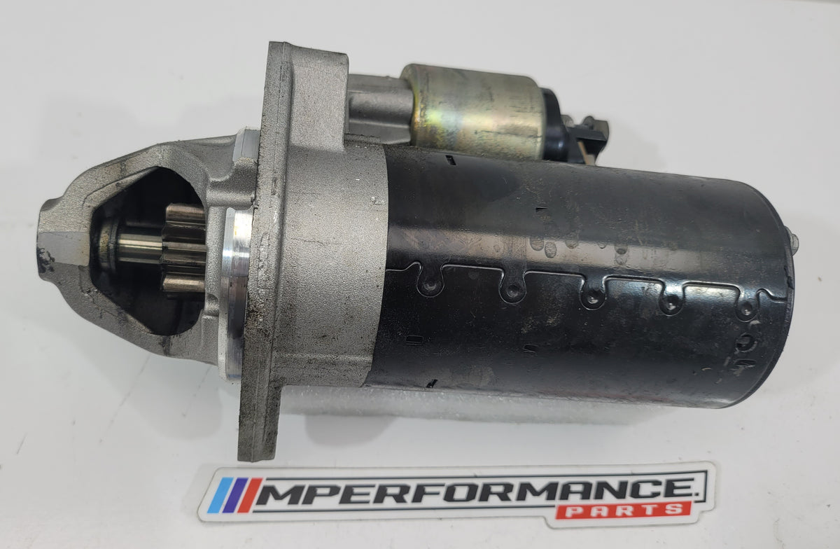Close-up of black MPerformance.parts engine component with detailed markings and branding, designed for BMW vehicles.