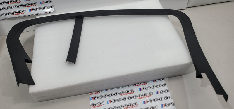Black rear left window frame trim for BMW G80 M3, part number 7447129, from MPerformance.parts, showing the trim installed on the door