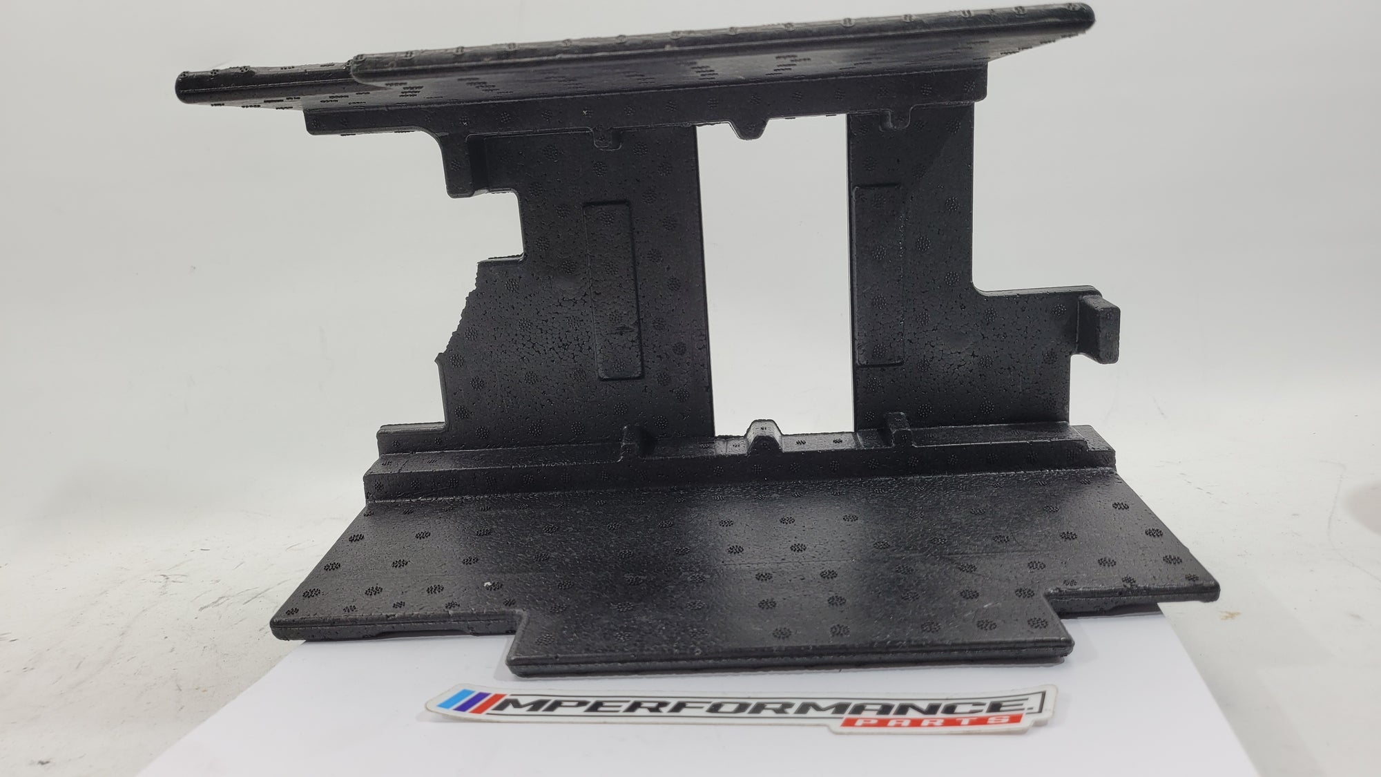 BMW 3 Series G20 G80 G28 M3 Competition battery holder tray by MPerformance.parts, showing the black plastic tray with mounting points.