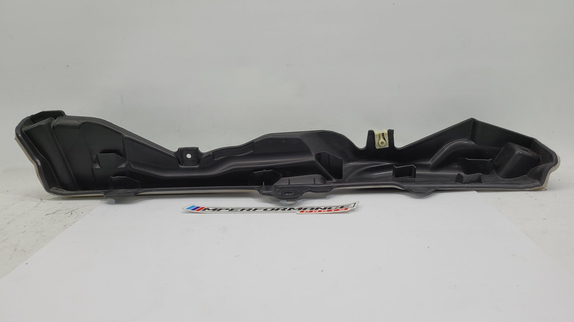 BMW M3 G8x engine compartment panel from MPerformance.parts, showing the black panel installed in the engine bay.