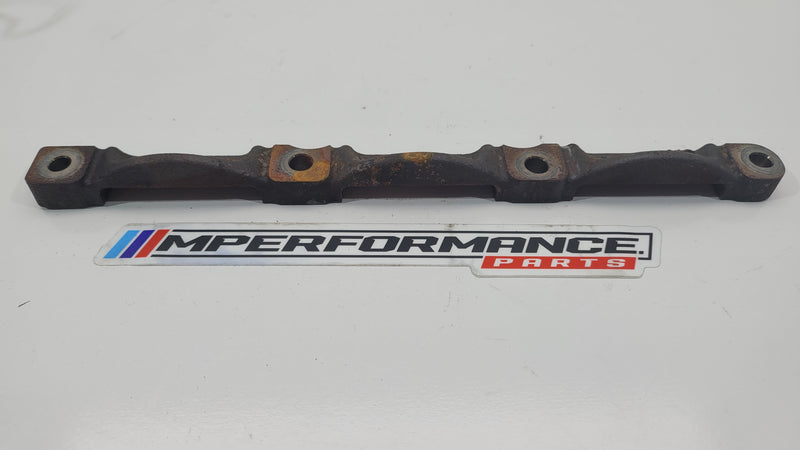 BMW G80 M3 exhaust manifold support brace bracket, part 68736810, shown in close-up of metal mounting bracket with bolts.