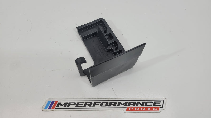 BMW M3 Series G80 positive battery terminal trim cover, black plastic accessory with MPerformance.parts branding visible.
