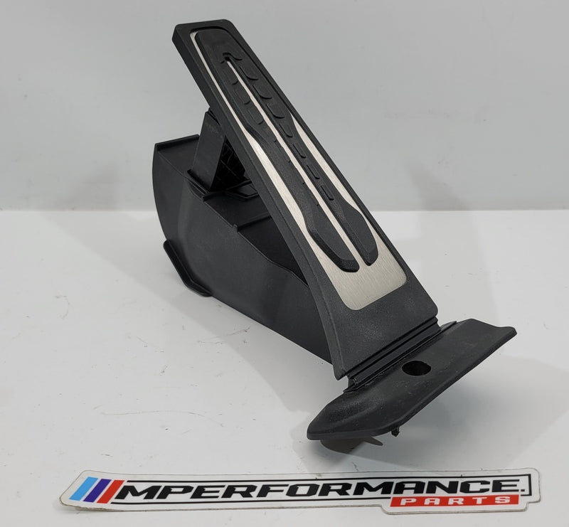 BMW G80 M3 accelerator pedal module by MPerformance.parts, auto part with textured surface and mounting points visible.