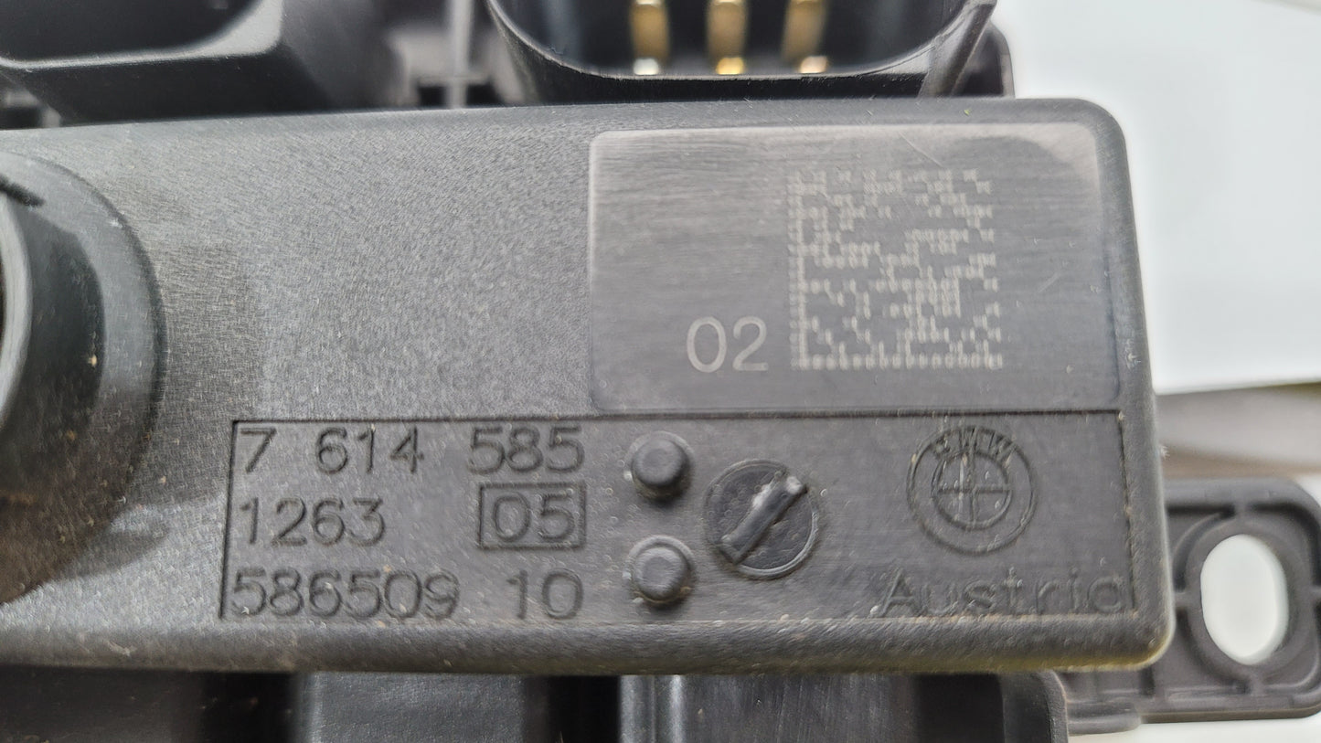 BMW F Series F8x M3 M4 integrated supply module, part number 7614585, shown in a close-up view.