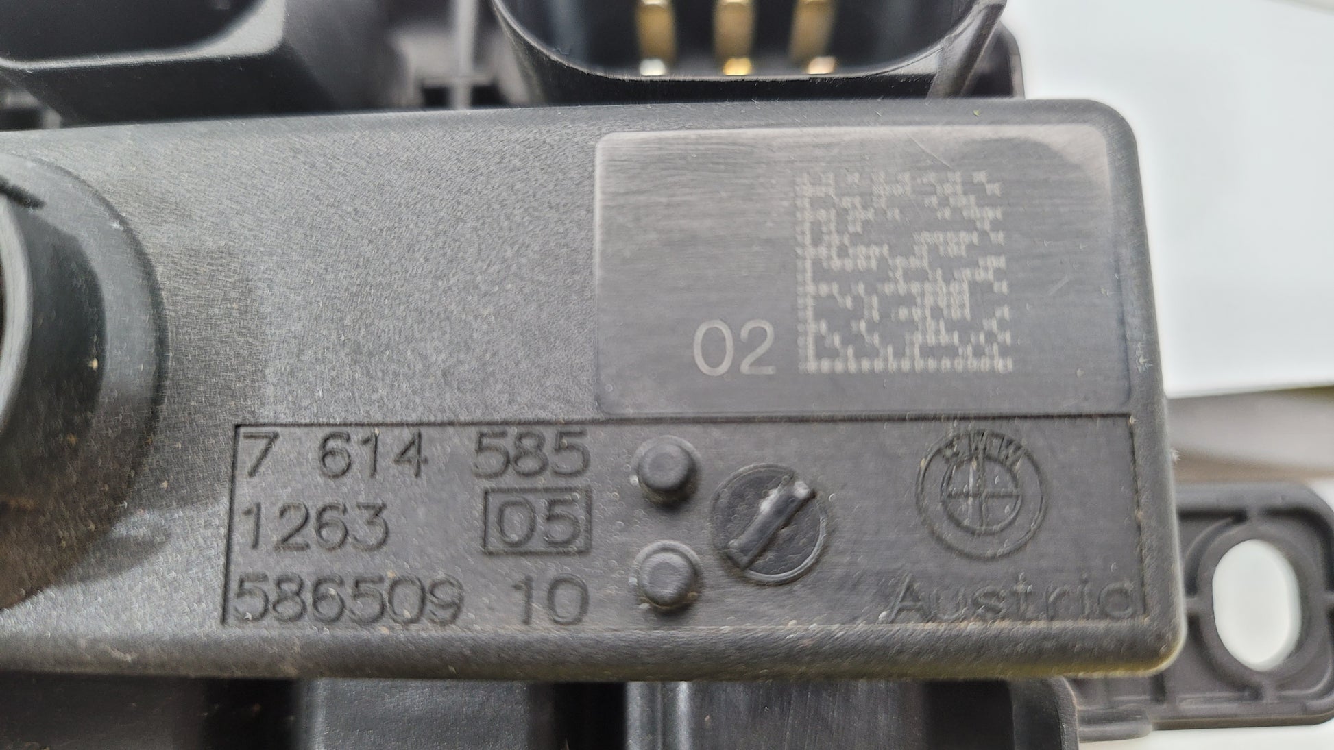 BMW F Series F8x M3 M4 integrated supply module, part number 7614585, shown in a close-up view.