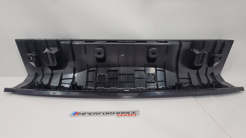BMW M3 G80 boot lock cover trim panel, black accessory with textured finish, part number 7438297, designed for MPerformance.parts.