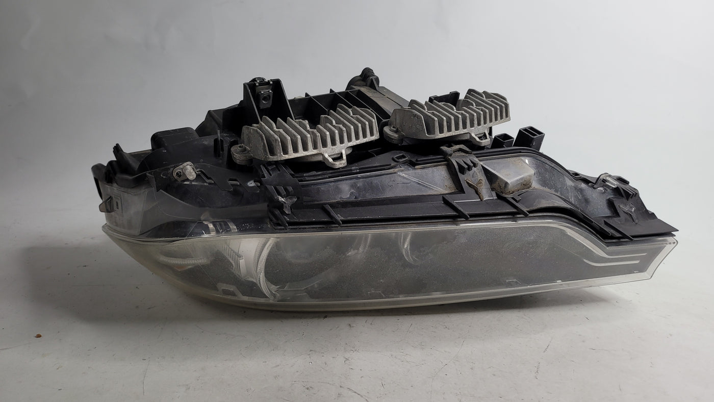 BMW 3 Series 2013-2019 passenger side xenon headlight headlamp in black for left side, part number 7259543.