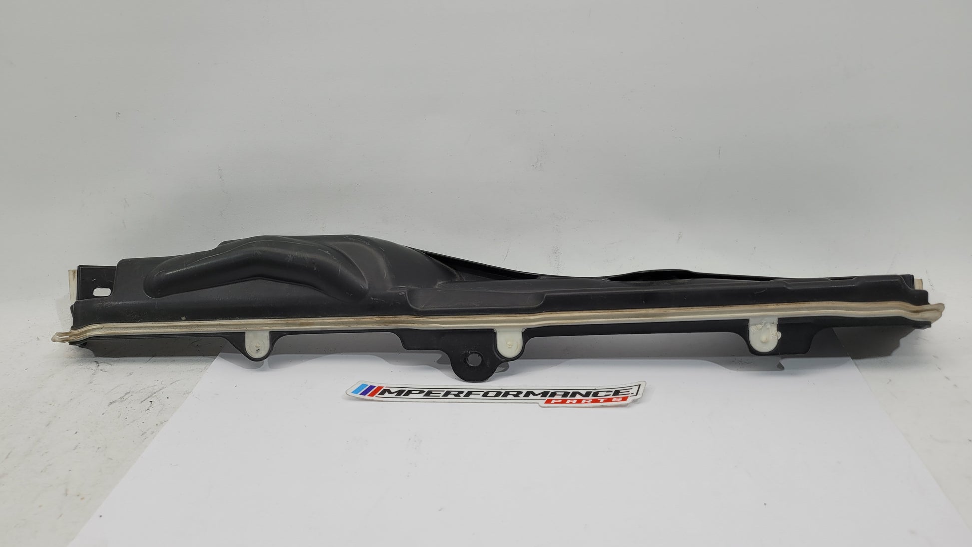 BMW M3 G8x engine compartment panel by MPerformance.parts, showing a sleek black panel with precise cutouts for engine access.