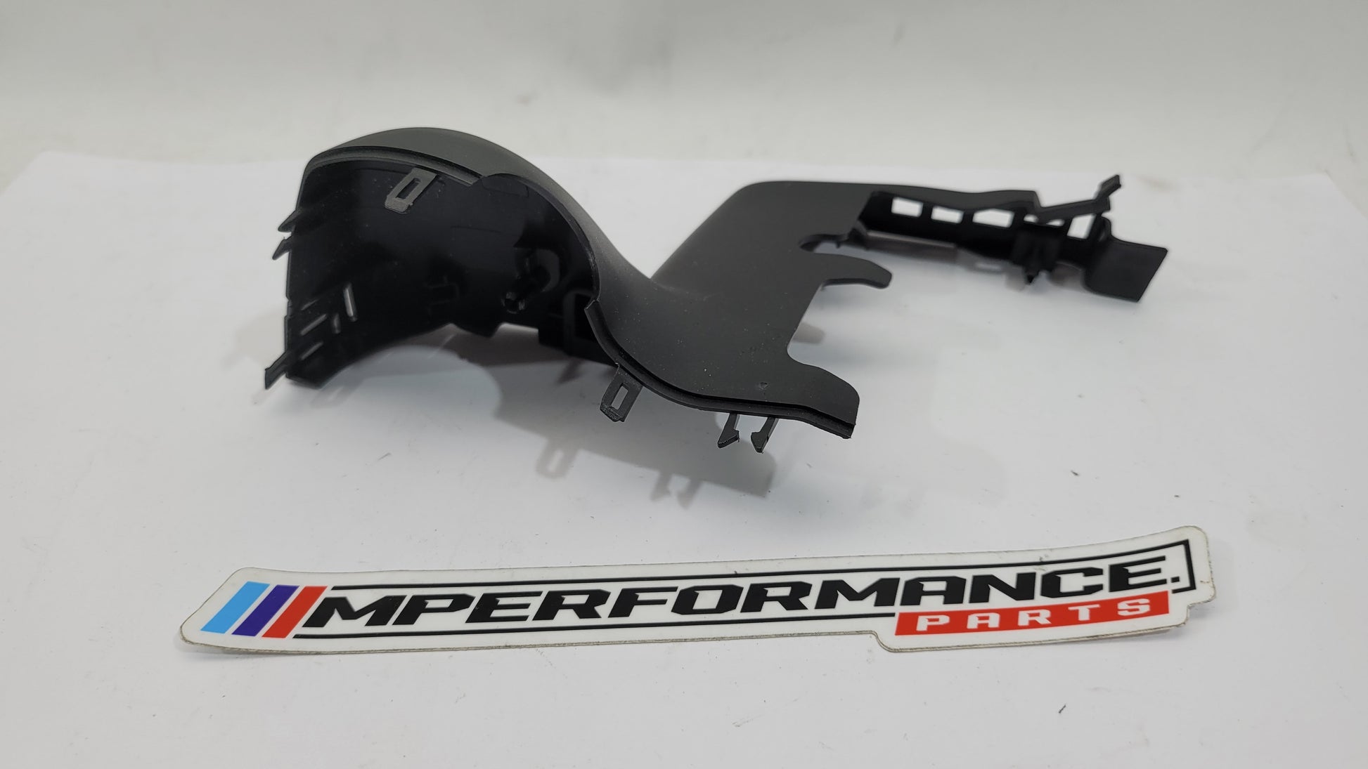 BMW G80 M3 mirror trim part from MPerformance.parts, showing sleek, shiny exterior mirror trim with detailed finish.