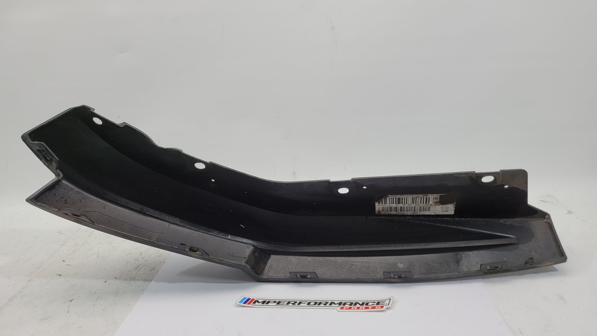BMW G80 M3 rear right bumper corner spat splitter by MPerformance.parts, showing the aerodynamic rear driver side bumper detail.