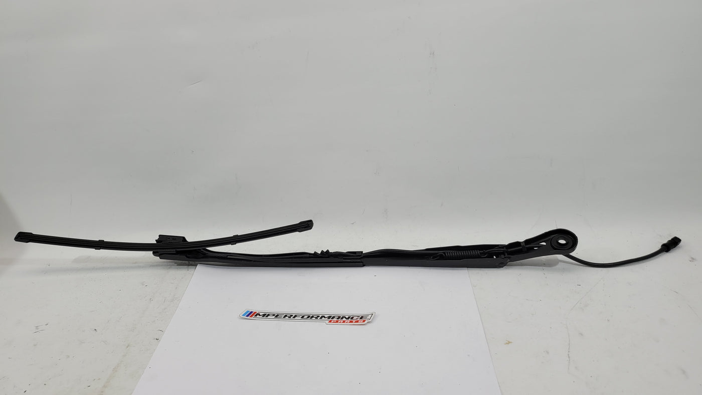 BMW M3 G8x passenger side front wiper arm from MPerformance.parts, showing the metal wiper arm with attachment points and mounting details.