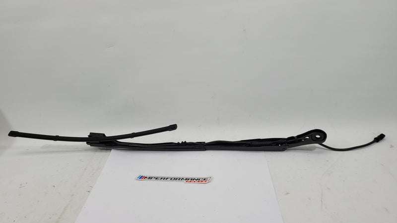 BMW M3 G8x passenger side front wiper arm from MPerformance.parts, showing the metal wiper arm with attachment points and mounting details.