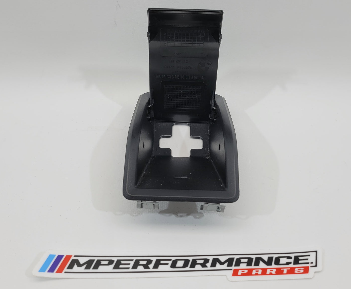 MPerformance.parts G8x child seat anchor cover, protective accessory for BMW G8x series, shown on car seat anchor area.