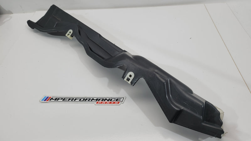 BMW M3 G8x engine compartment panel from MPerformance.parts, showing the black metal panel with mounting points and automotive details.