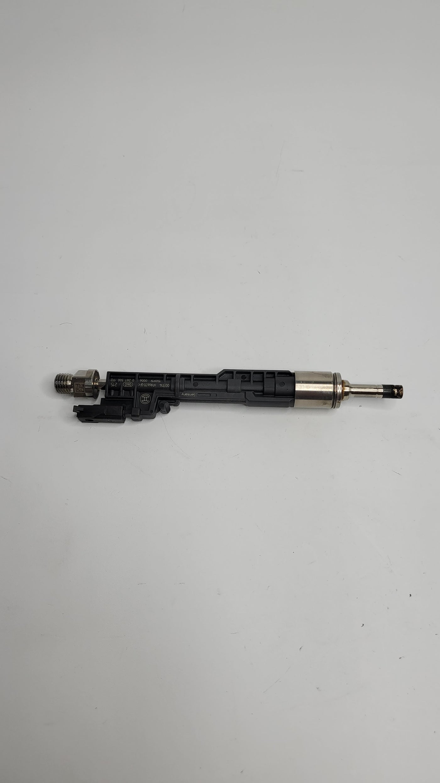 F80 M3 injector part number 0261500172 from MPerformance.parts, showing the fuel injector with detailed metal components.
