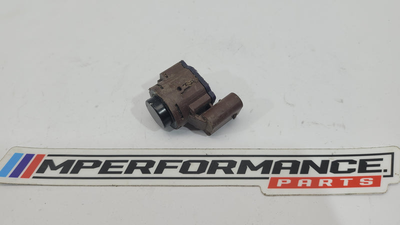 BMW M2 G87 bumper PDC parking distance sensor from MPerformance.parts, showing a close-up of the sensor integrated into the bumper.