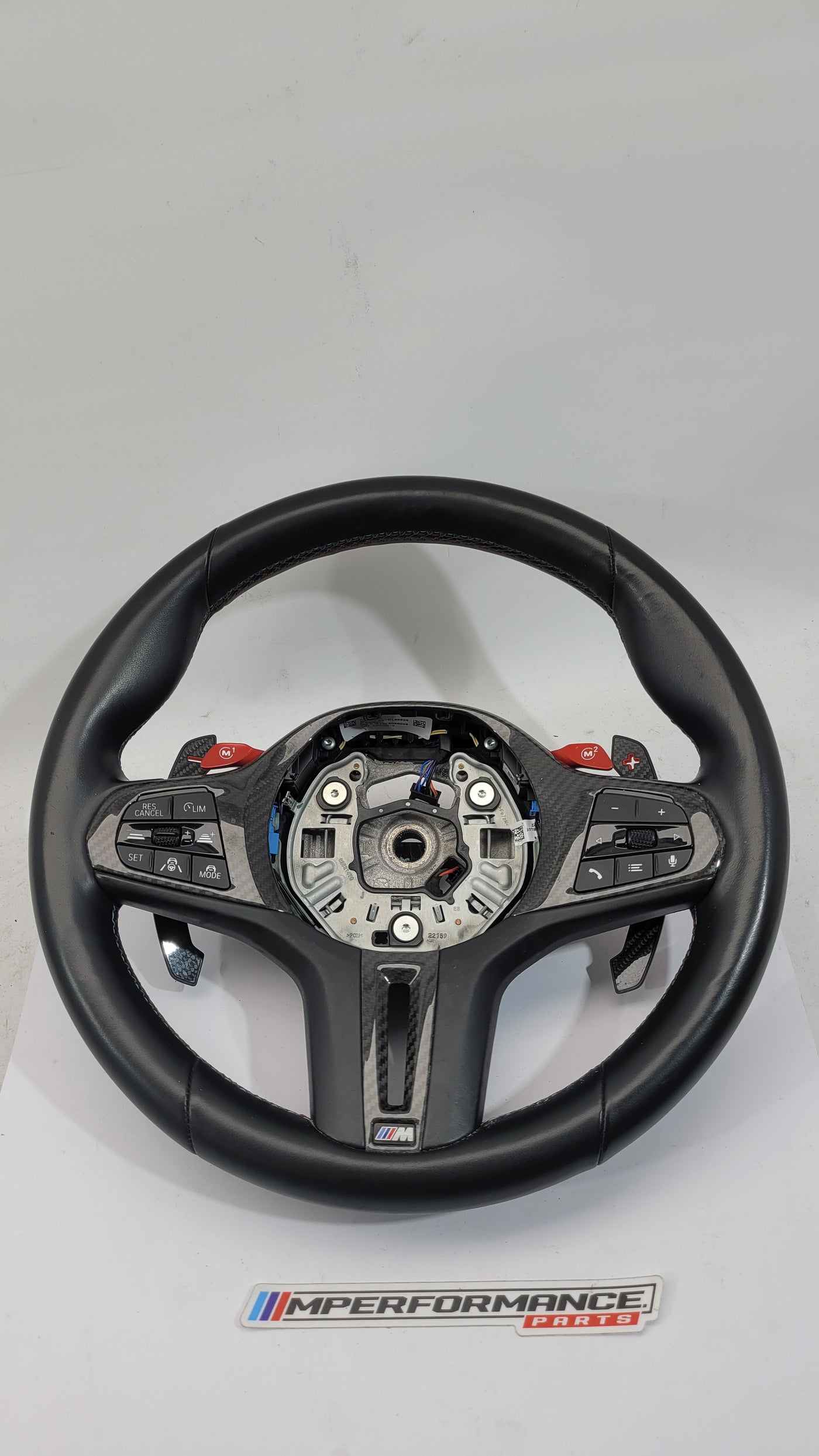 BMW M2 M3 M4 G80 G82 leather M Performance steering wheel with black leather and M logo, sporty design for high-performance driving.