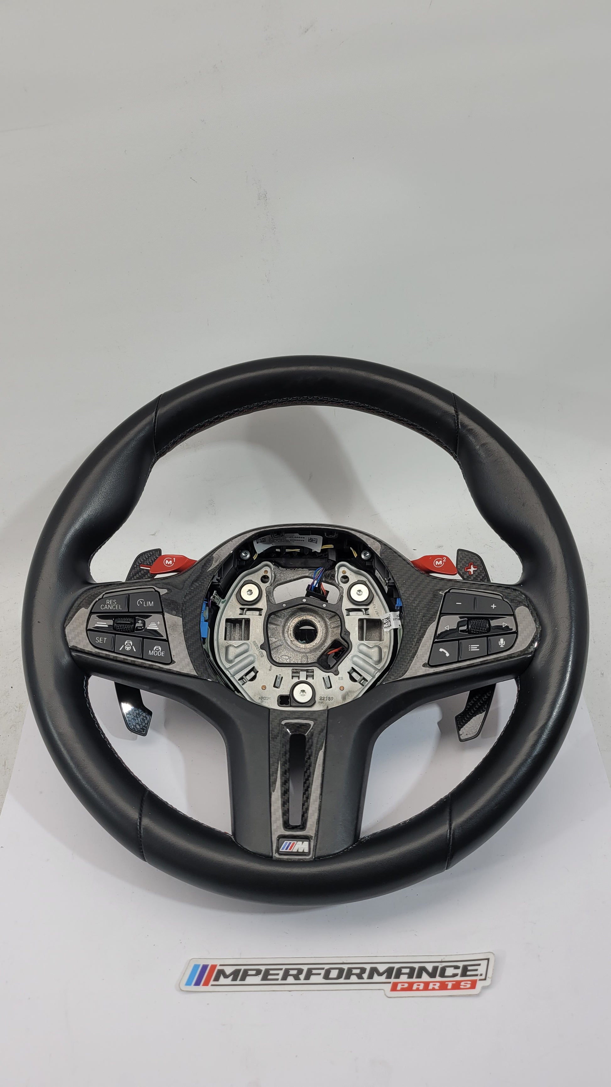 BMW M2 M3 M4 G80 G82 leather M Performance steering wheel with black leather and M logo, sporty design for high-performance driving.