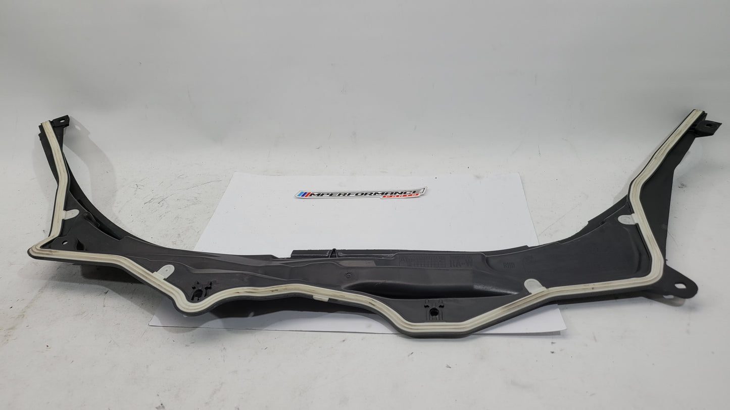 BMW M3 G8X firewall upper section cover panel by MPerformance.parts, showing the sleek black metal engine compartment cover.