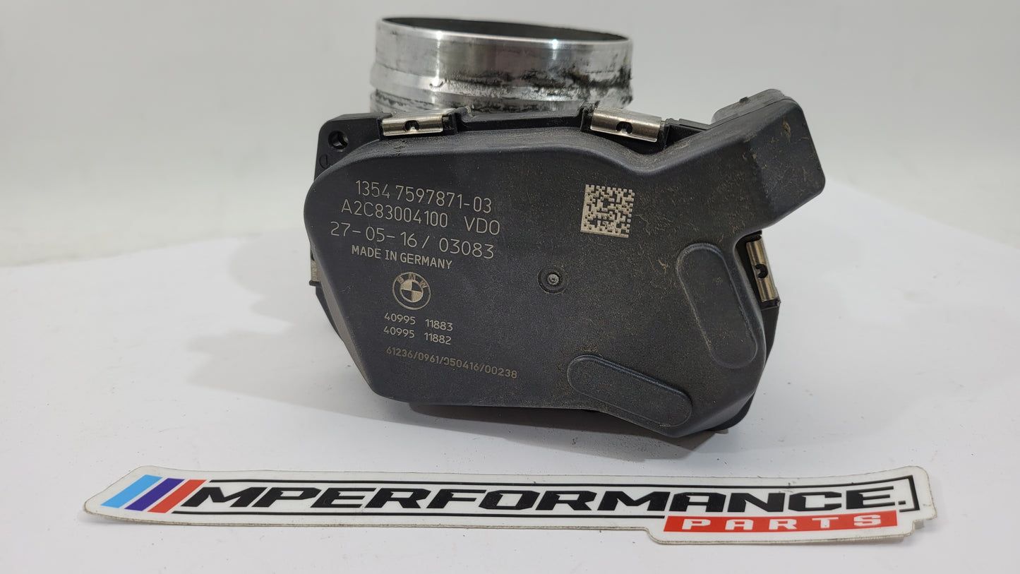 BMW M3 M4 F80 F82 F83 S55 engine throttle body by MPerformance.parts, showing the metal component with mounting points and electronic connectors.