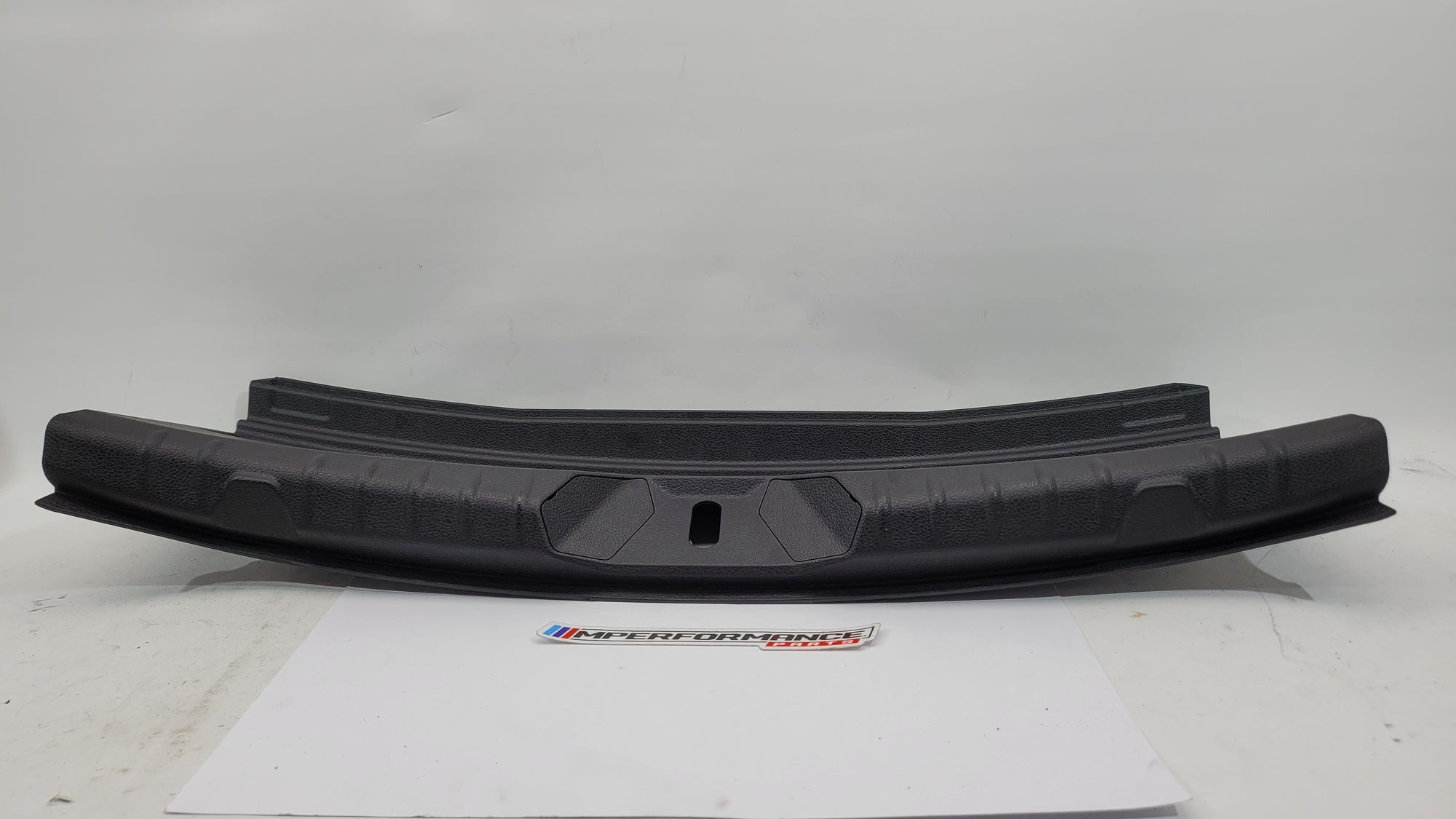BMW 2 Series Coupe F22 F87 trunk boot lock trim in black with MPerformance.parts branding, designed for a sleek, custom look.
