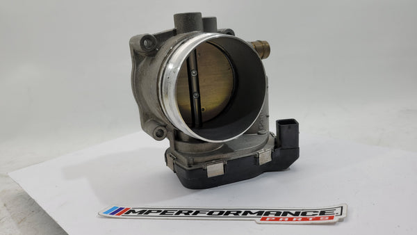 BMW M3 M4 F80 F82 F83 S55 engine throttle body by MPerformance.parts, showing the metal component with mounting points and electronic connections.