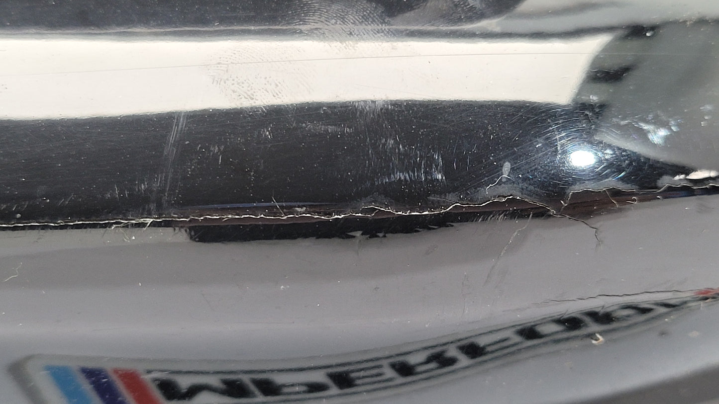 BMW G80 M3 rear bumper left corner spat splitter by MPerformance.parts, featuring black plastic with textured finish.