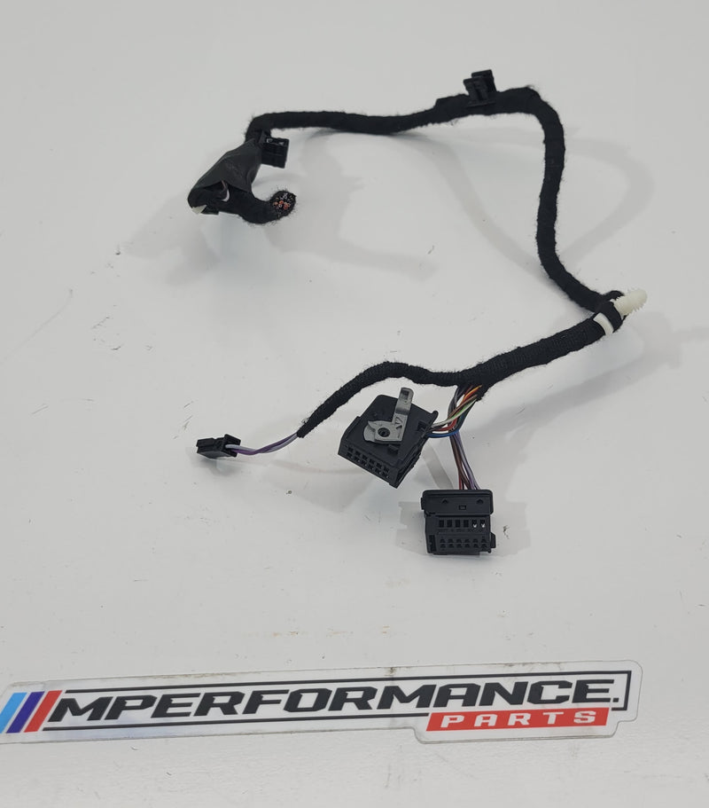MPerformance.parts flag plugs in black with white branding, designed for automotive use, showing close-up of the product.