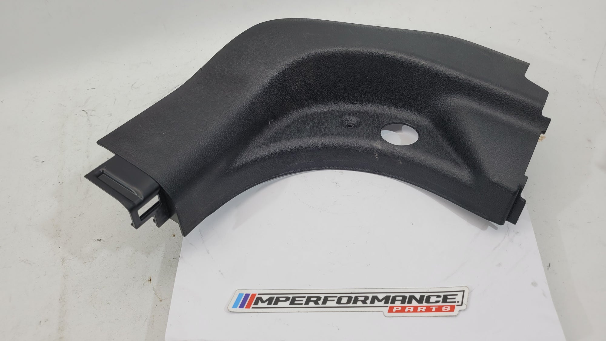 BMW G80 M3 right lower A pillar trim replacement part by MPerformance.parts, showcasing the sleek black interior trim piece.