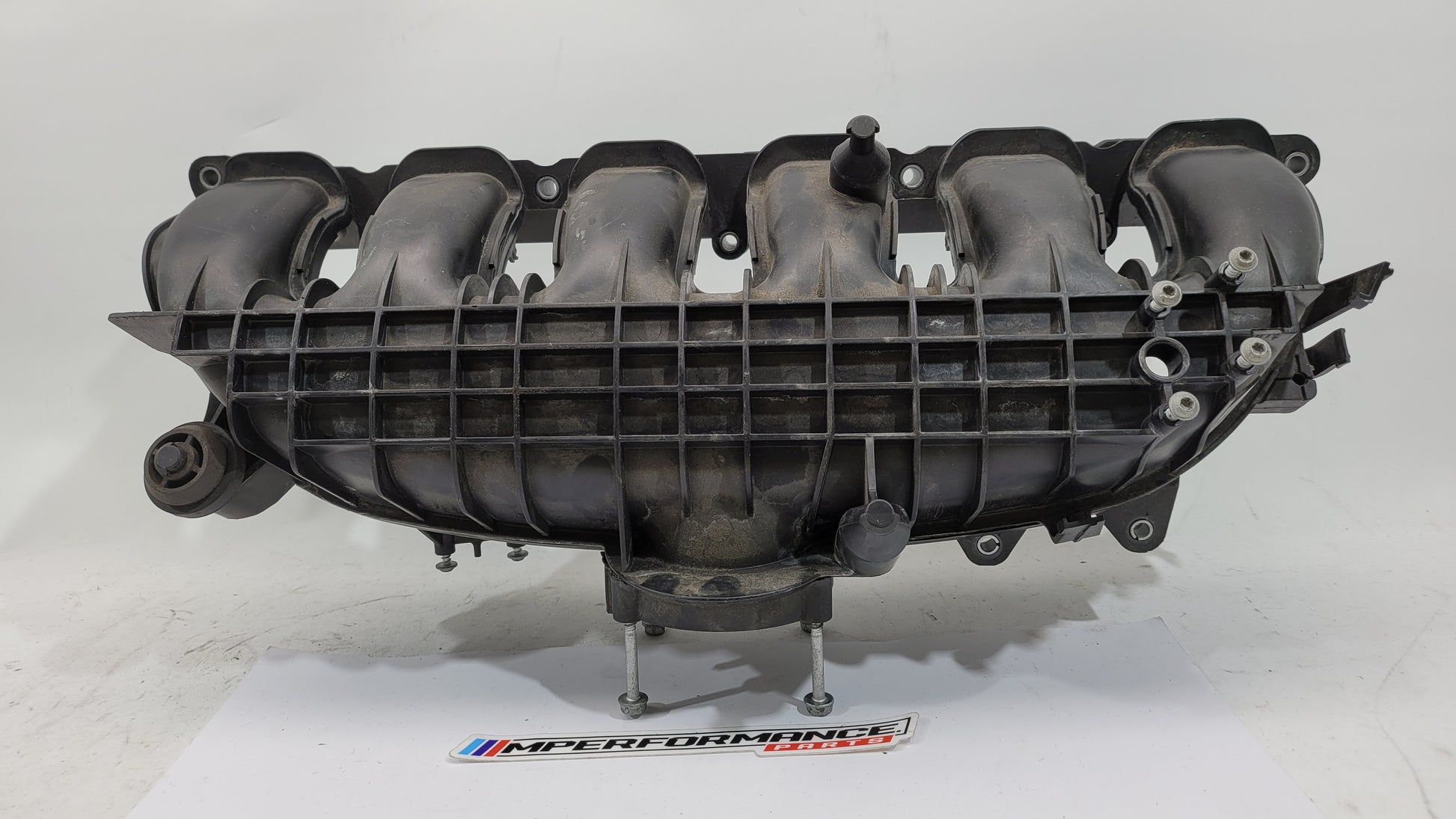 BMW N55 S55 3.0L engine intake manifold from MPerformance.parts, showing the metal construction and inlet ports for BMW 335i M3 M4 F80.