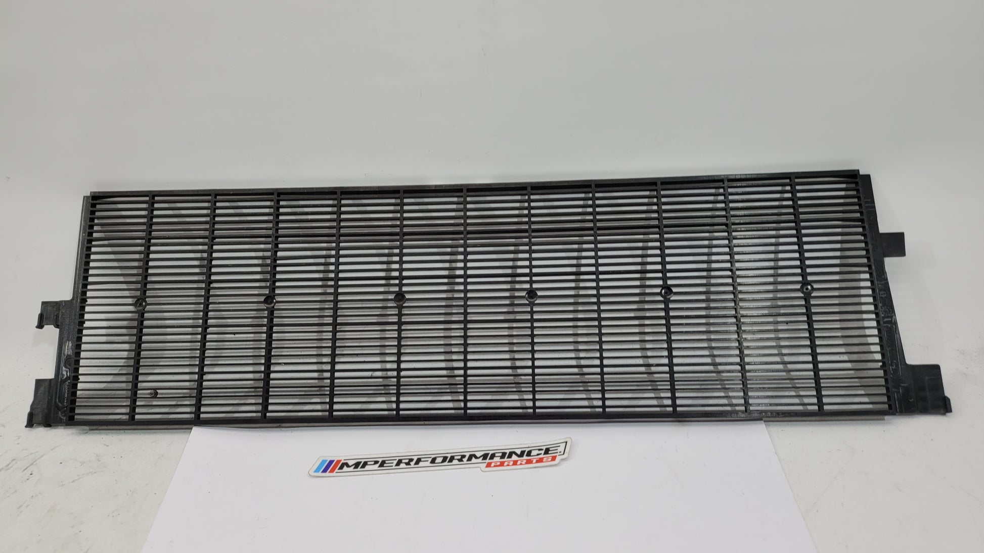 BMW G80 G82 G83 M3 M4 Competition plastic radiator cover shroud by MPerformance.parts, shown installed in engine bay.