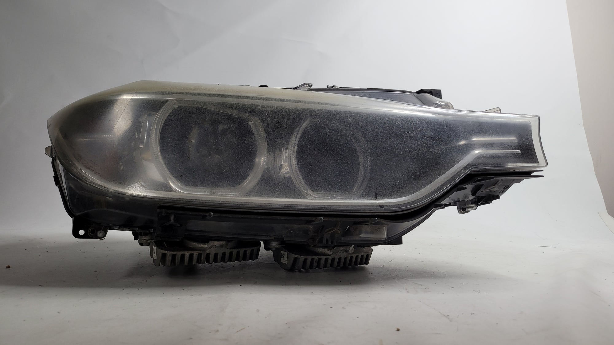 BMW 3 Series 2013-2019 right driver side xenon headlight headlamp from MPerformance.parts, showing the illuminated headlamp assembly.