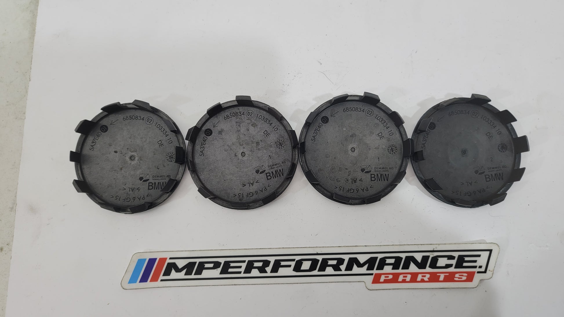 BMW 50th Anniversary G80 wheel cap set of 4 by MPerformance.parts, featuring sleek design and iconic logo for G80 model wheels.