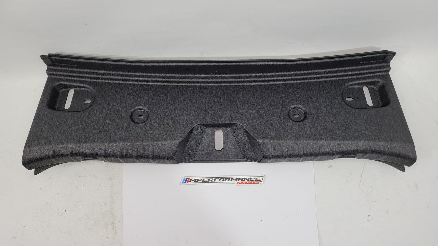 BMW 2 Series F22 F87 coupe trunk boot lock trim in black with MPerformance.parts branding, close-up view of the car's rear.
