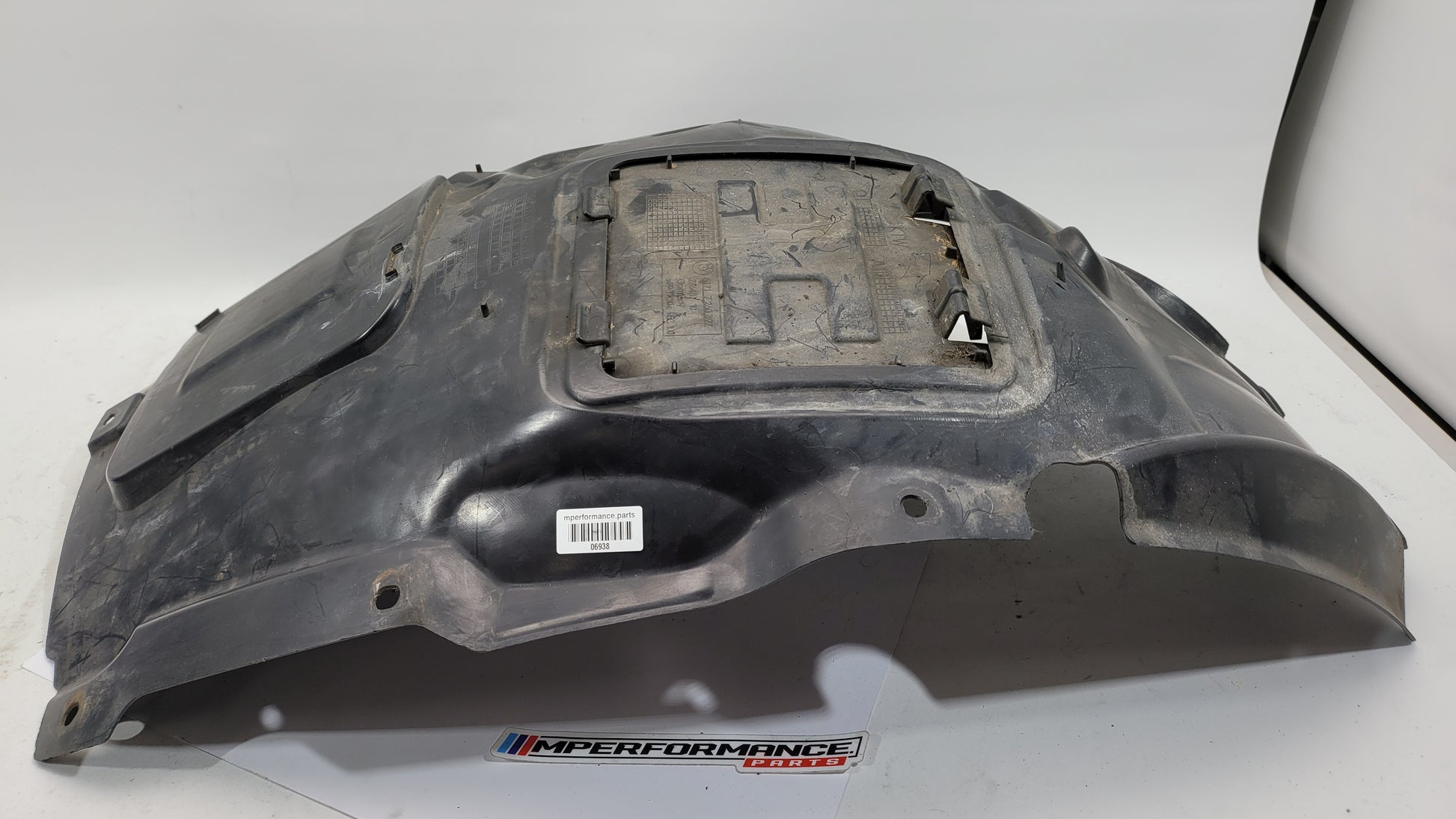 BMW 3 Series F30 F31 MSport front left wheel arch liner cover, passenger side, in black plastic with mounting points.