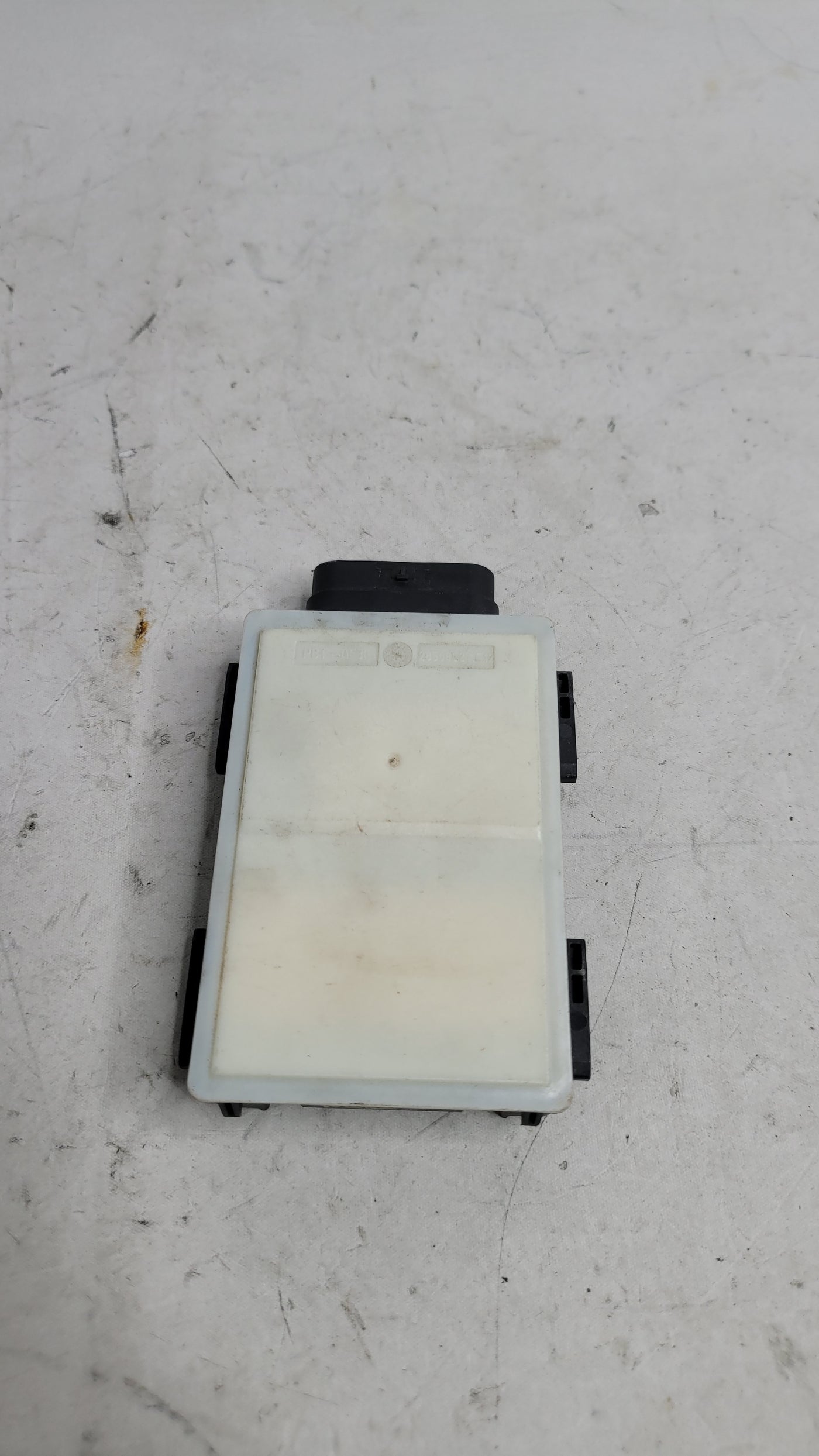 BMW M3 G80 front radar sensor, OEM part by MPerformance.parts, shown in close-up with black and metallic finish.