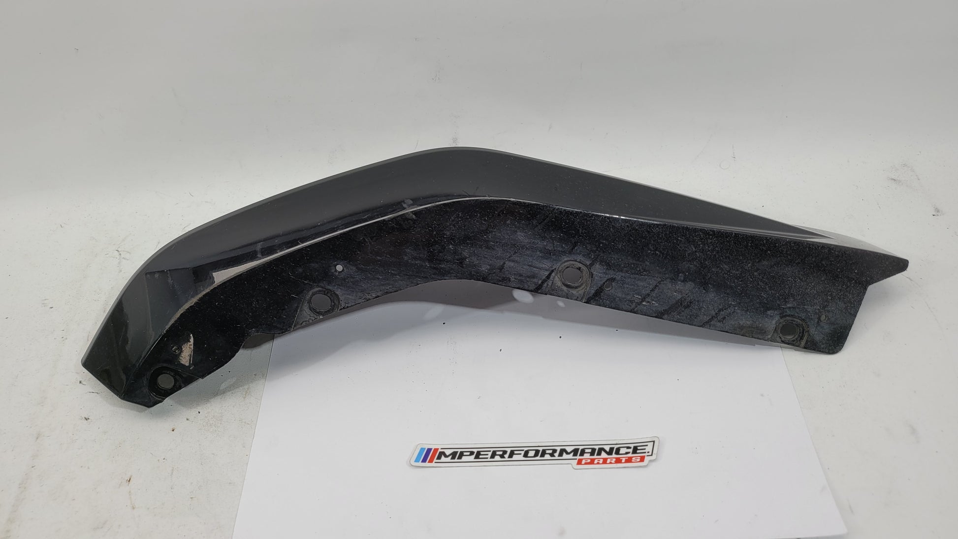 BMW G80 M3 bumper corner spat splitter rear driver right side, MPerformance.parts, shows the black plastic exterior part.