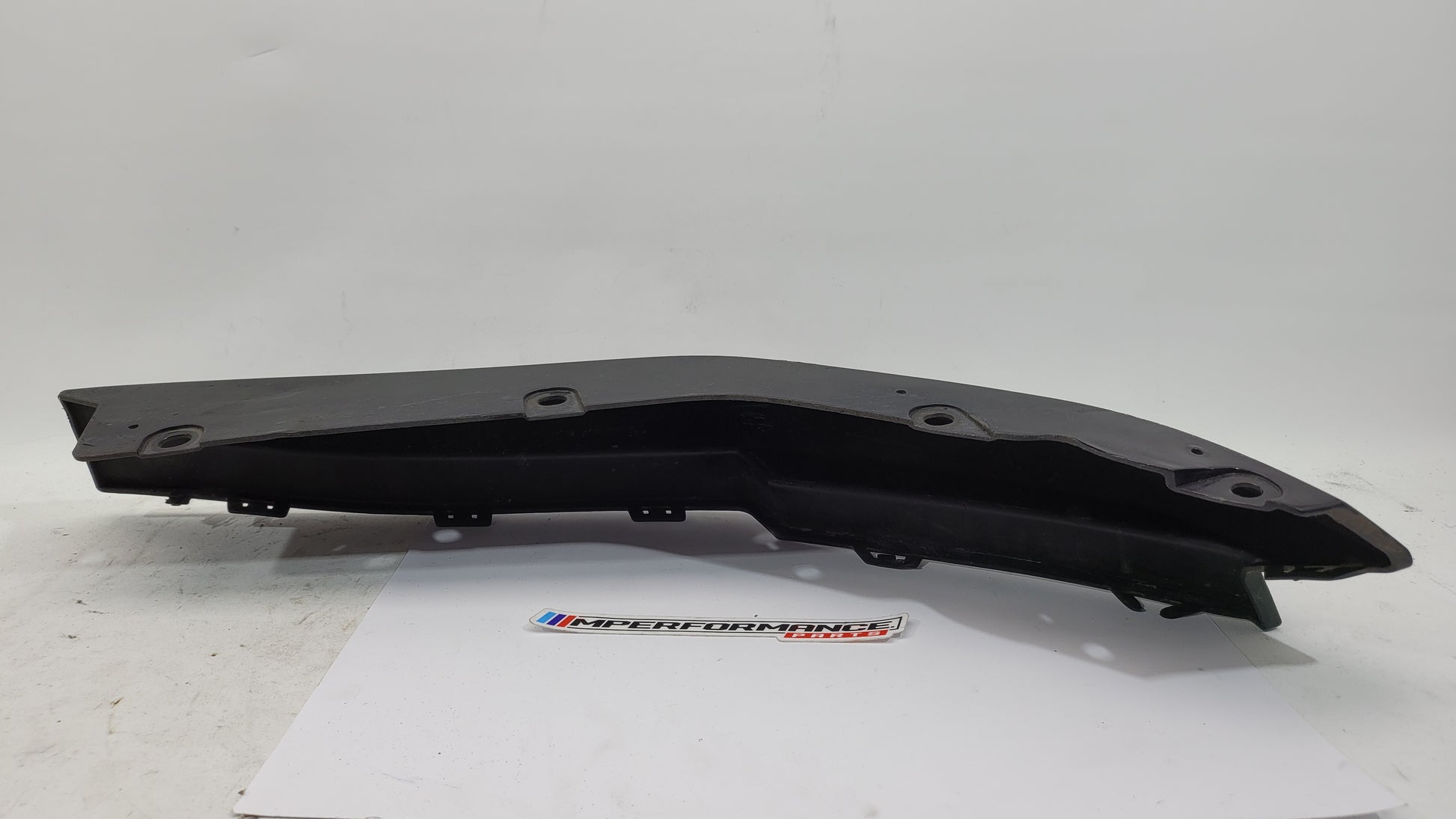 BMW G80 M3 rear bumper left corner spat splitter in black, designed for the 2021-2024 model with MPerformance.parts branding.