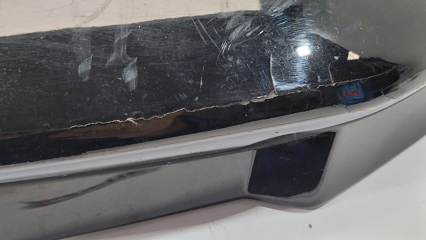 BMW G80 M3 rear bumper left corner spat splitter, black plastic part with textured finish for sporty appearance.