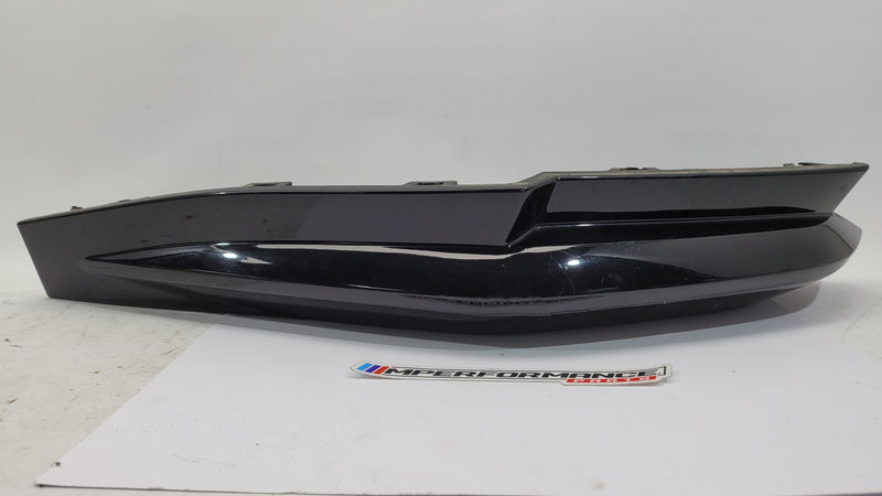 BMW G80 M3 rear bumper left corner spat splitter in black, designed for sporty aerodynamic enhancement.