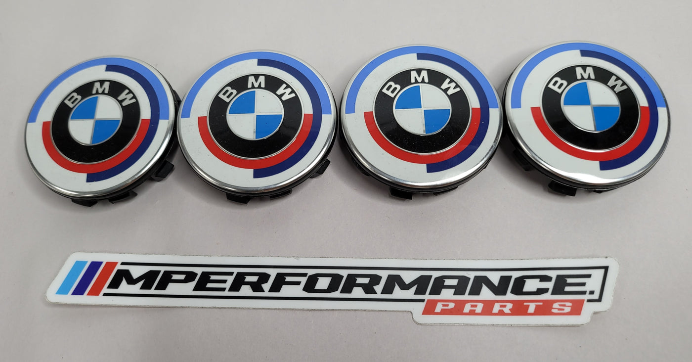 BMW MPerformance.parts 50 Years of BMW M center cap emblem, OEM 103334-10 X4, showing the iconic M logo on a shiny metal surface.
