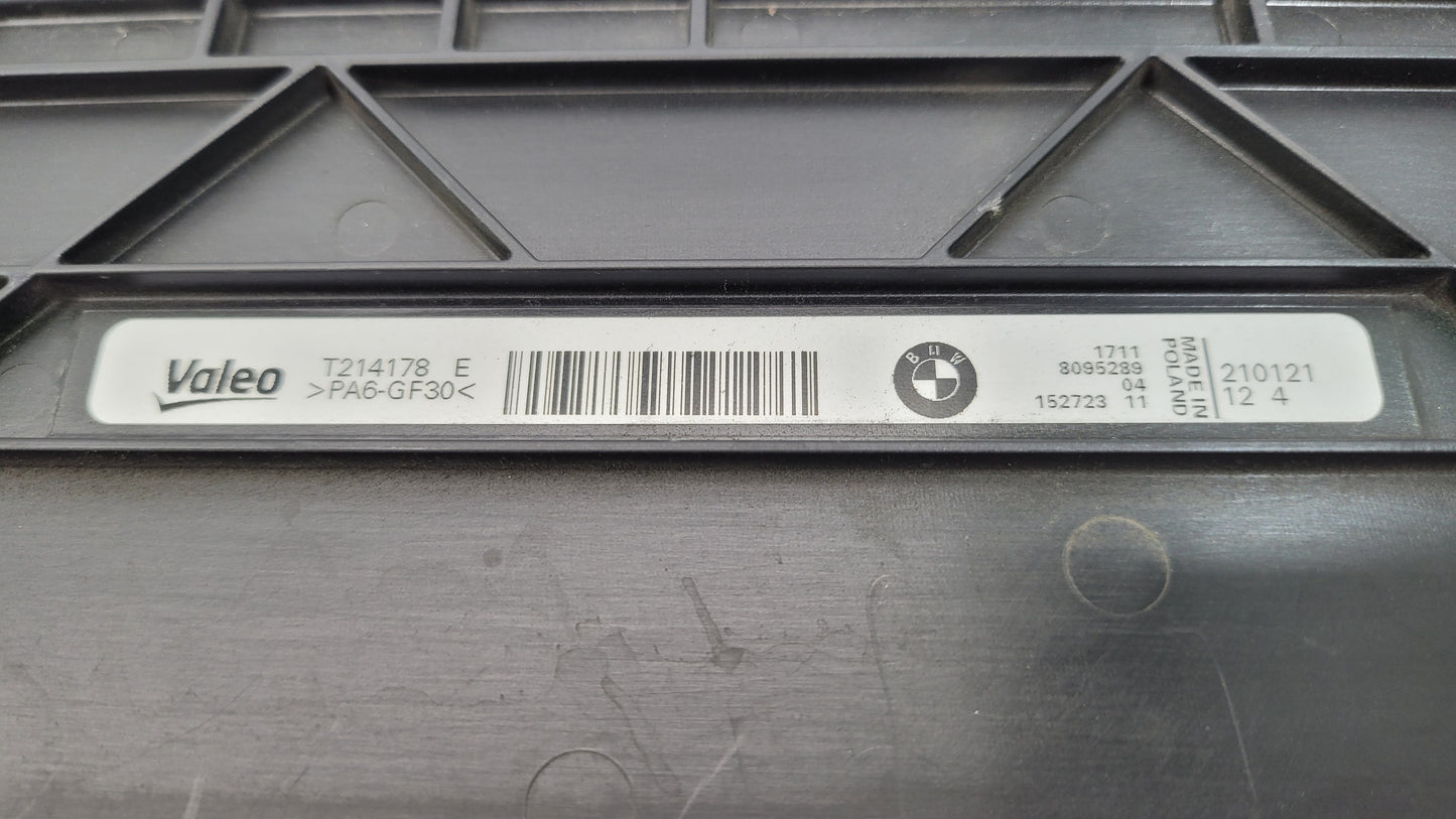 BMW M3/4 G8x cooling radiator upper cover from MPerformance.parts, showing the sleek black plastic design with mounting points.