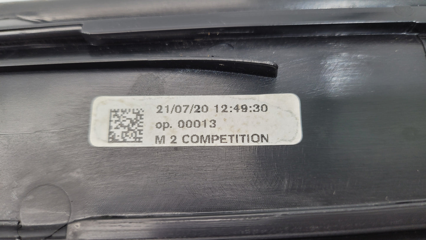 BMW M2 Competition F87 door sill scuff plate, left or right, from MPerformance.parts, showing close-up of black protective surface.