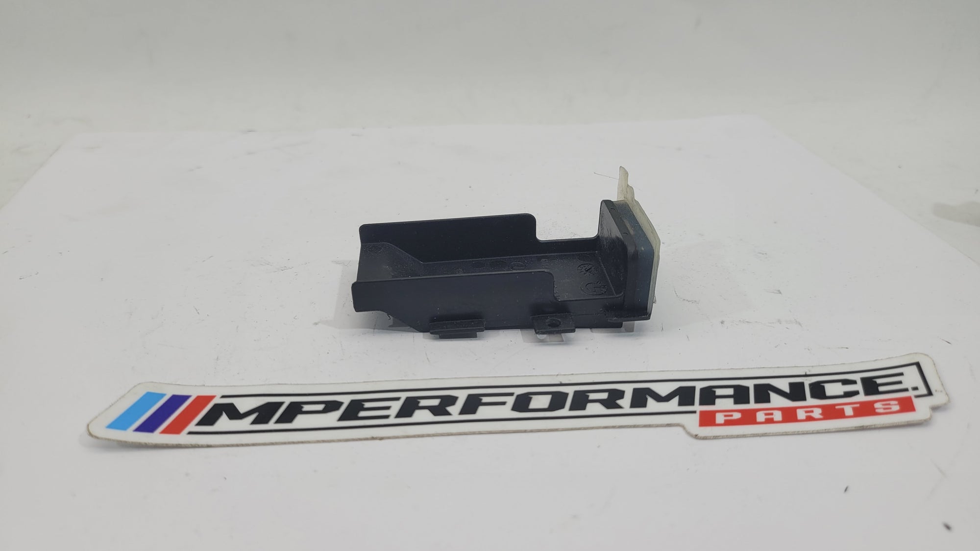 BMW 1 3 4 Series F20 F21 F30 F31 F32 F33 battery cover base by MPerformance.parts, showing the black plastic engine compartment component.