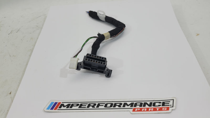 BMW OBD2 port 9335261 from MPerformance.parts, close-up of the black connector with wiring, designed for automotive diagnostics.