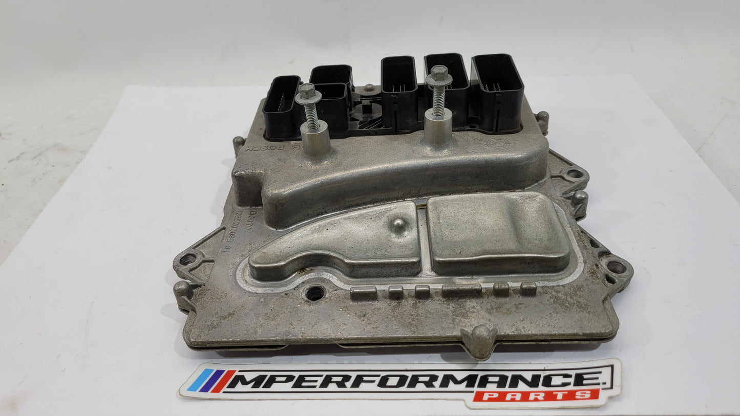 BMW M4 F82 3.0 petrol engine control module by MPerformance.parts, showing the black electronic module with connector ports.
