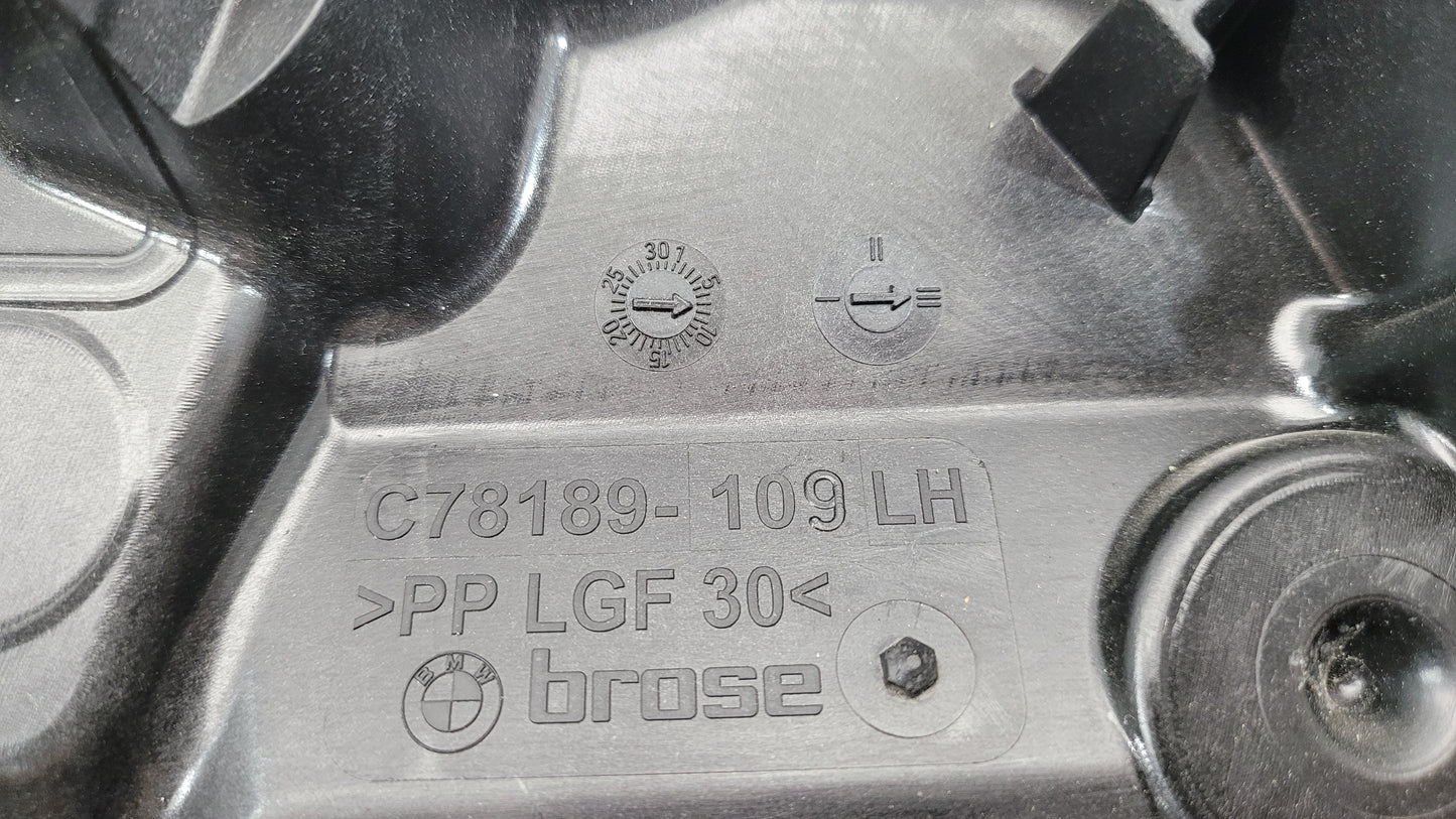 BMW M3 Series G20/G8x rear left window regulator and motor, part 7432235, with visible metal components and wiring.